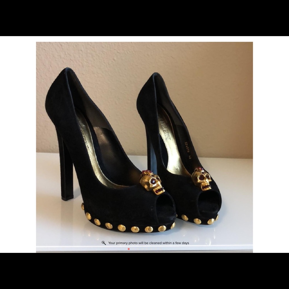 Alexander McQueen black Daim Velour skull pumps.